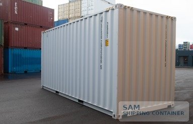 Light-colored 20ft shipping container, corner three-quarter view in a container yard
